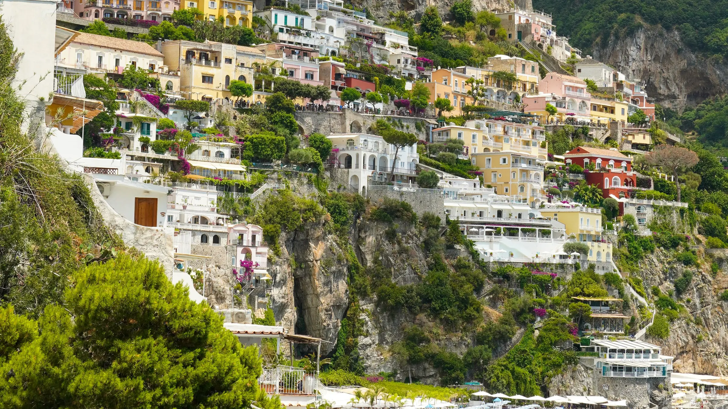 Positano from above, beach and houses stacked on the cliff