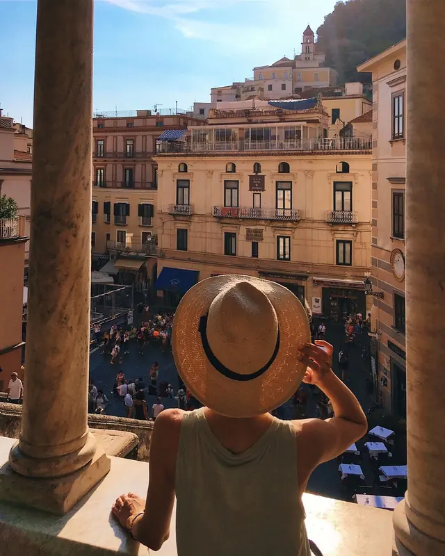 Piazza in Amalfi, seen from behind a visitor